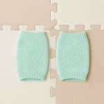 Close-up of soft mint green wool toddler knee protector leg warmers