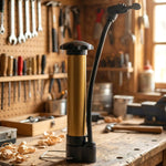 A person's hand holding the lightweight and easy-to-use Mini Hand Air Pump for sports.