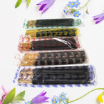 Lit  Pancham incense stick releasing fragrant smoke, creating a calming atmosphere.