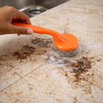 Close-up of scrubber brush head showing durable heavy duty cleaning surface