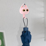 Side profile of the creative wink cat adhesive coat hook showing its sturdy build.