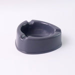 Unbreakable grey plastic ashtray with smooth surface for easy cleaning