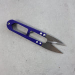 Close-up view of sharp stainless steel blades on sewing scissors