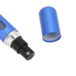 Gold-toned 5ml mini spray bottle, emphasizing its luxurious and portable design.