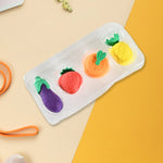 Pack of 4 small, cute fruit and vegetable erasers, ideal for kids' stationery.