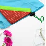 A collection of sturdy reusable shopping bags with handles, ideal for carrying groceries.