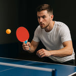 Top view of Konex table tennis paddles and lightweight orange balls