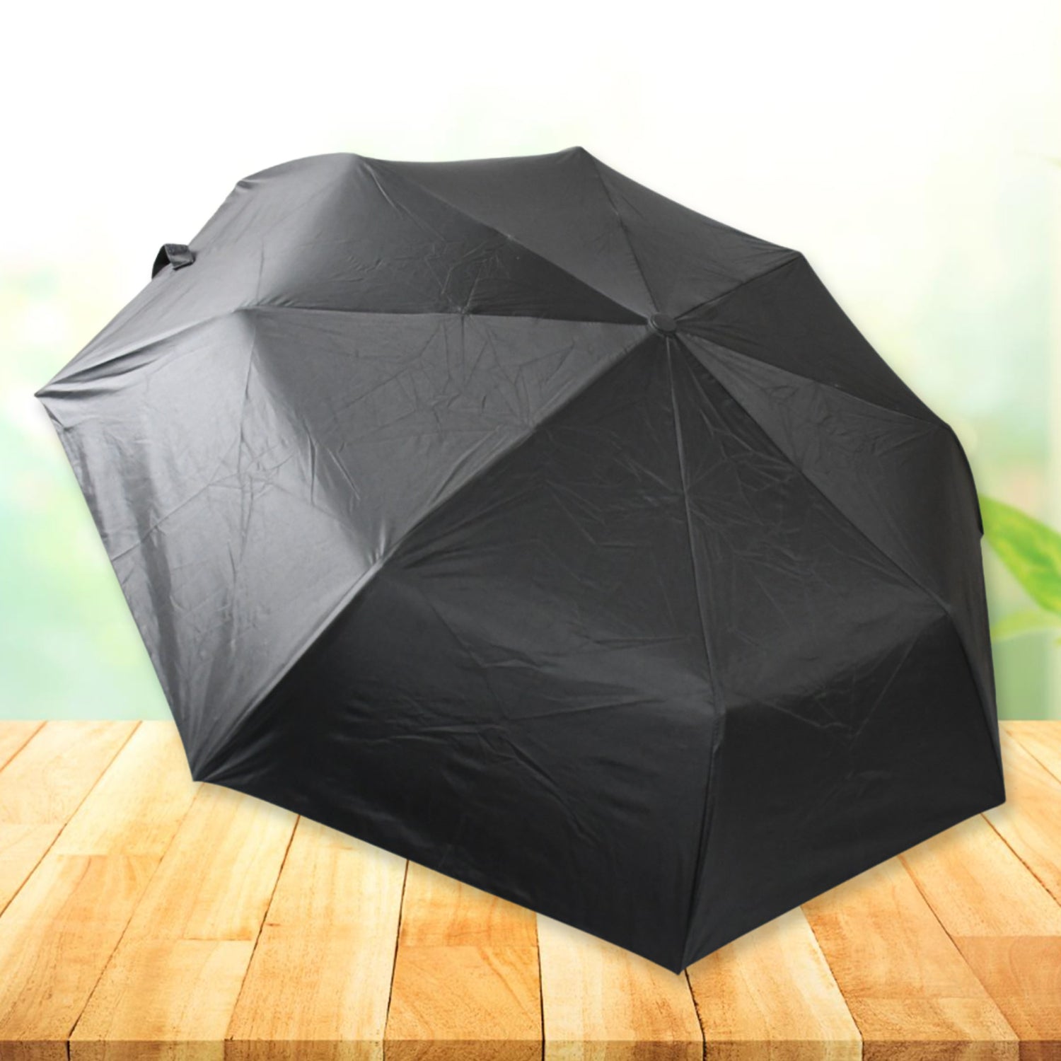 Fully open black umbrella demonstrating its wide canopy and waterproof polyester fabric.