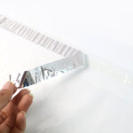 Self-adhesive flap on courier polybag ensuring tamper-proof seal