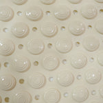 Flexible anti-slip bath mat folded to show versatility and easy storage