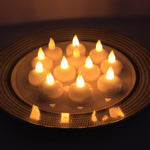 LED floating candles arranged on water surface enhancing home décor ambiance