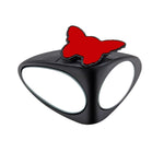 Hands installing self-adhesive car blind spot mirror on vehicle side mirror