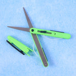 Detail of the retractable handle mechanism on the portable pen scissors.