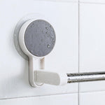 Self-adhesive towel rod mounted on a white clean wall