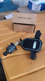 Driver's perspective showing gravity phone holder mounted on dashboard air vent