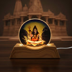 Soft warm glow of Lord Shiva LED night light illuminating bedroom corner