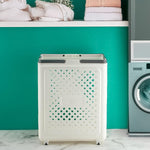 Close-up of foldable laundry basket showing ventilation holes and plastic material