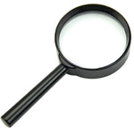 Portable 50mm magnifying glass for reading small print in a newspaper.