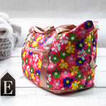 Several foldable travel bags in different colours, showcasing their design and functionality.