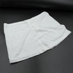 Women's high-waisted athletic skort front view in white.