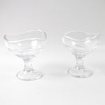 Clear glass dessert bowl highlighting its sturdy footed base.