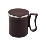 A stylish insulated tea mug in yellow, showcasing its comfortable handle and compact size.