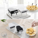 Close-up of the decorative piano fruit forks, highlighting their intricate design and functionality.
