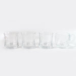 Stackable glass tumblers and mugs, part of a durable and practical drinkware collection.