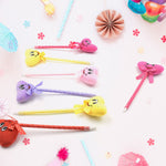 Collection of 12 fun cartoon and heart design ballpoint pens with rattles.
