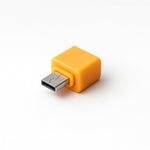 Micro USB OTG Adapter held in hand, demonstrating its portability for mobile use.