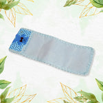 Protective cloth remote cover with a charming cartoon pattern and lace details.