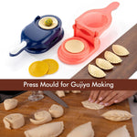 Close-up of the plastic Gujiya and momo mould, showing its ergonomic handle.