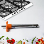Both the gas lighter and vegetable peeler from the CookAura combo in use.
