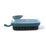 Close-up of the dispensing laundry cleaning brush in use
