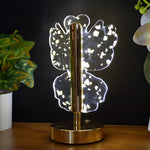 Side view of decorative golden crystal LED table lamp with butterfly motif