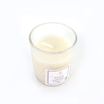 Top view of French Lavender soy candle glowing with warm flame