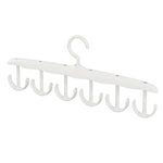 Side view of the space-saving tank top hanger with garments, showcasing its slim profile.