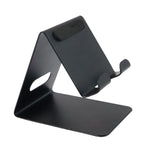 Phone holder placed on table providing stable support for a mobile device