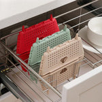 Close-up of the ventilated design and folding mechanism of the storage basket.
