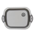 Versatile kitchen tool acting as both a cutting surface and a storage basket.