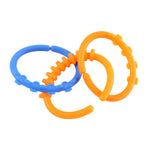 Three baby link rings showing bright colors and textured surfaces for teething