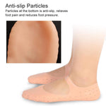 Side view of a foot wearing a soft gel sock, designed to heal and moisturize cracked feet.