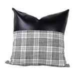 Stylish Leather & Cotton Pillow Cover adding a chic touch to a home interior.