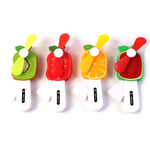Compact portable kid's cooling fan shaped like a fruit for travel use