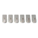 Wall hooks hanging keys and towels in home setting