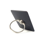 Side profile of the compact phone ring stand, highlighting its slim design.