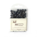 Close-up of strong hold round head push pins on cork board