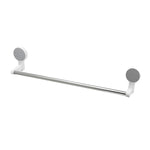 Wall-mounted adhesive towel rod holding towels in bathroom setting