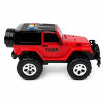 Kids' friction powered toy jeep driving on outdoor terrain