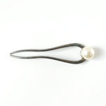 Close-up of pearl hair pin detail
